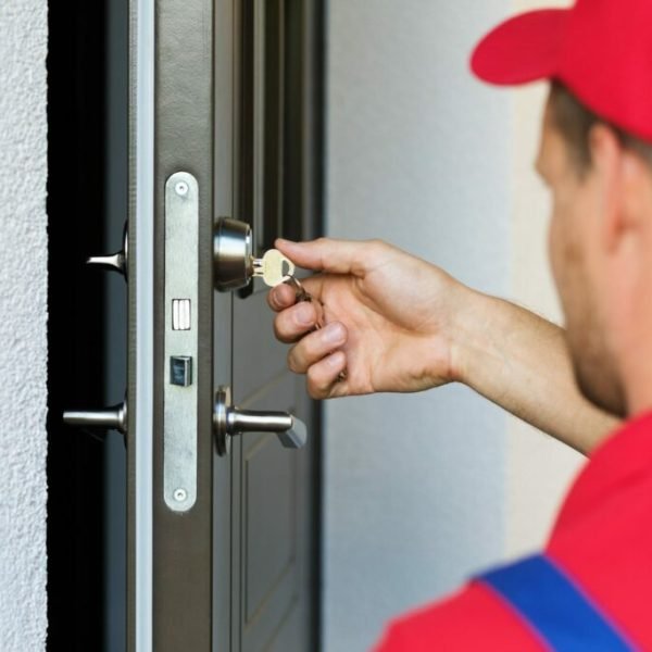 door-lock-service-locksmith-working-in-red-uniform-scaled-1-1024x683