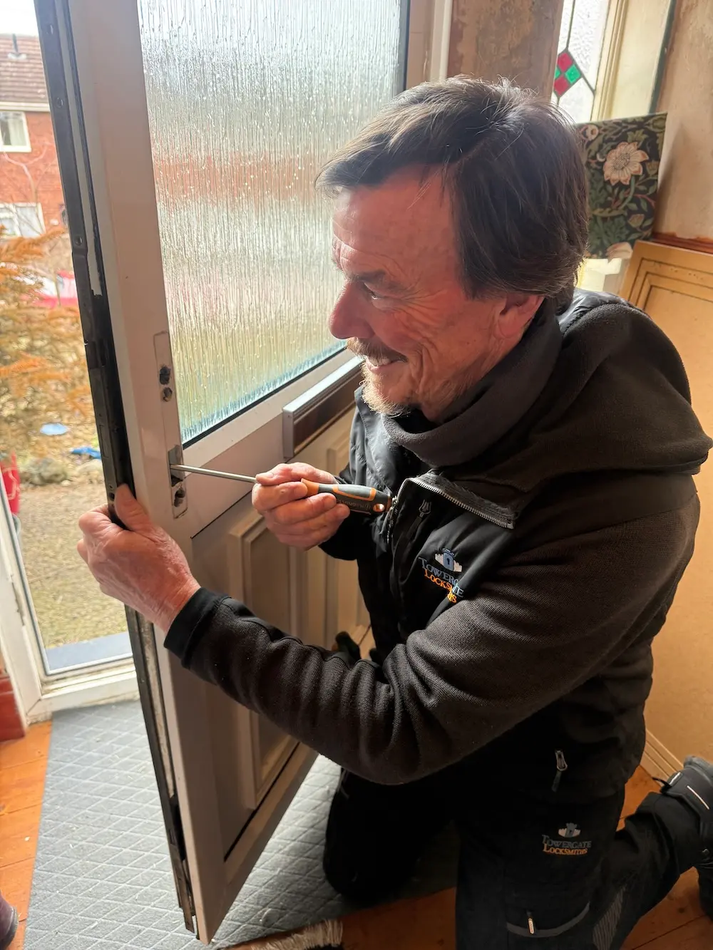UPVC Door Lock Failure York: Mechanism Replacement 2 Towergate Locksmiths technician installing new multipoint lock mechanism in UPVC door Holgate York